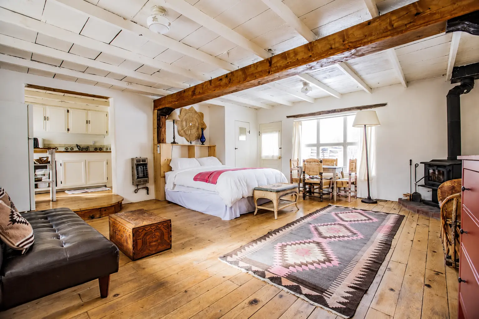 Bedroom with bed and living area